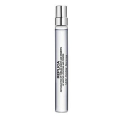 Maison Margiela Replica Eau de Toilette spray bottle and its original white packaging box, featuring a clear glass bottle with a silver spray nozzle and a white label with black text.