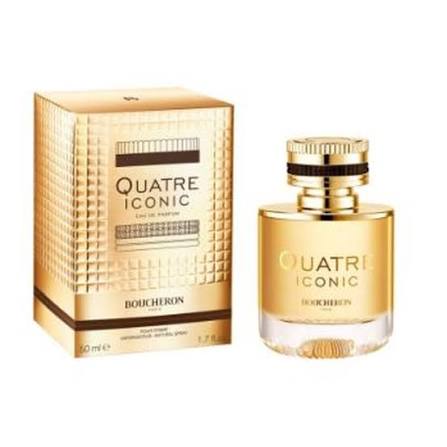 Boucheron Quatre Iconic Eau de Parfum bottle with amber liquid next to its metallic gold packaging box on a white background.