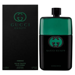 Gucci Guilty Essence Eau de Toilette bottle and packaging box. The bottle is a dark translucent green and black with a green Gucci logo, standing next to its black box featuring the green Gucci logo.