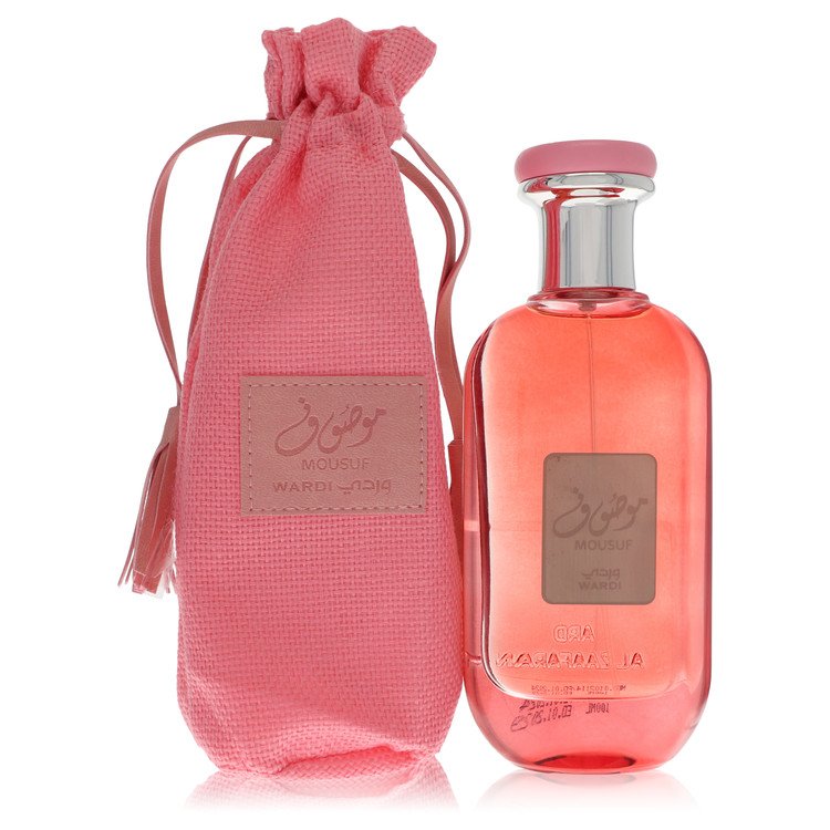 Pink perfume bottle with matching drawstring bag on a white background