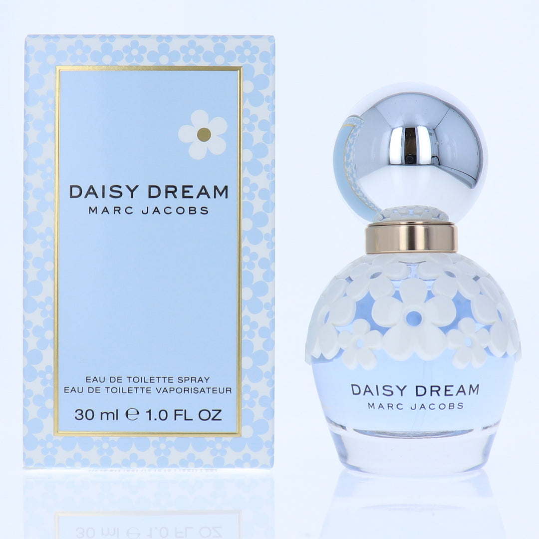 Marc Jacobs Daisy Dream perfume bottle and packaging on a light blue background