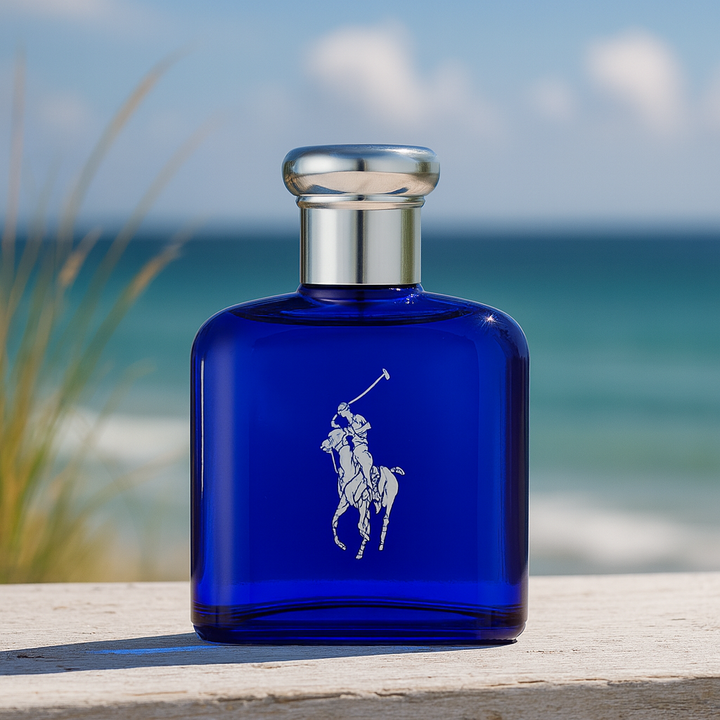 Blue Ralph Lauren perfume bottle with a silver cap on a wooden surface with a beach background.