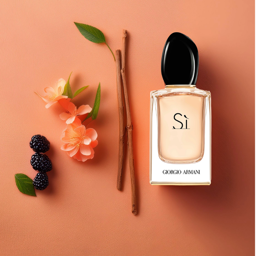 Giorgio Armani Si perfume bottle with flowers and blackberries on a peach background