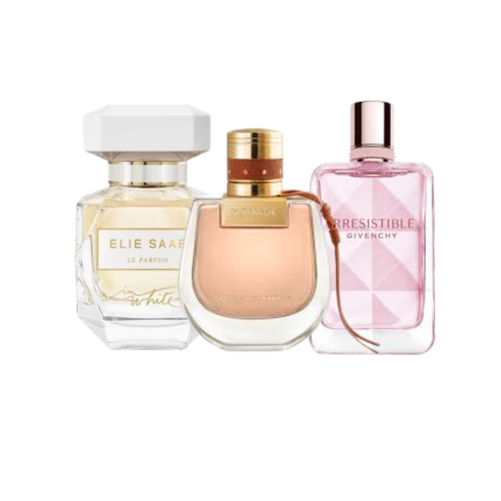 Three perfume bottles from Elie Saab, Givenchy, and another brand on a white background