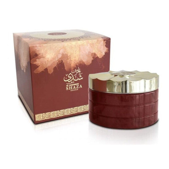 image showing the bottle and packaging for Al Haramain Shaza Dhahab Perfume By Al Haramain Bakhoor Incense 75g