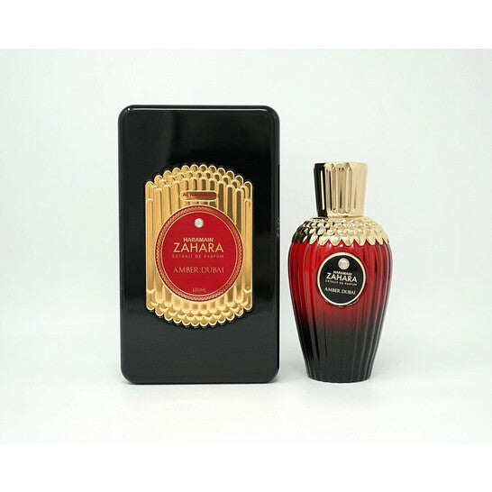 image showing the bottle and packaging for Al Haramain Zahara Amber Dubai Cologne By Al Haramain Extrait De Parfum Spray 100ml
