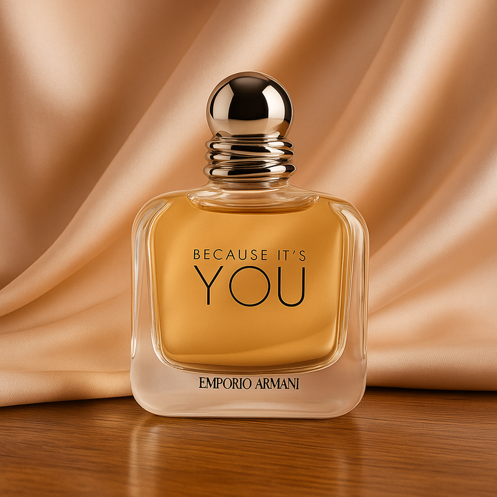 Perfume bottle with 'Because It's You' text and Emporio Armani branding on a beige fabric background