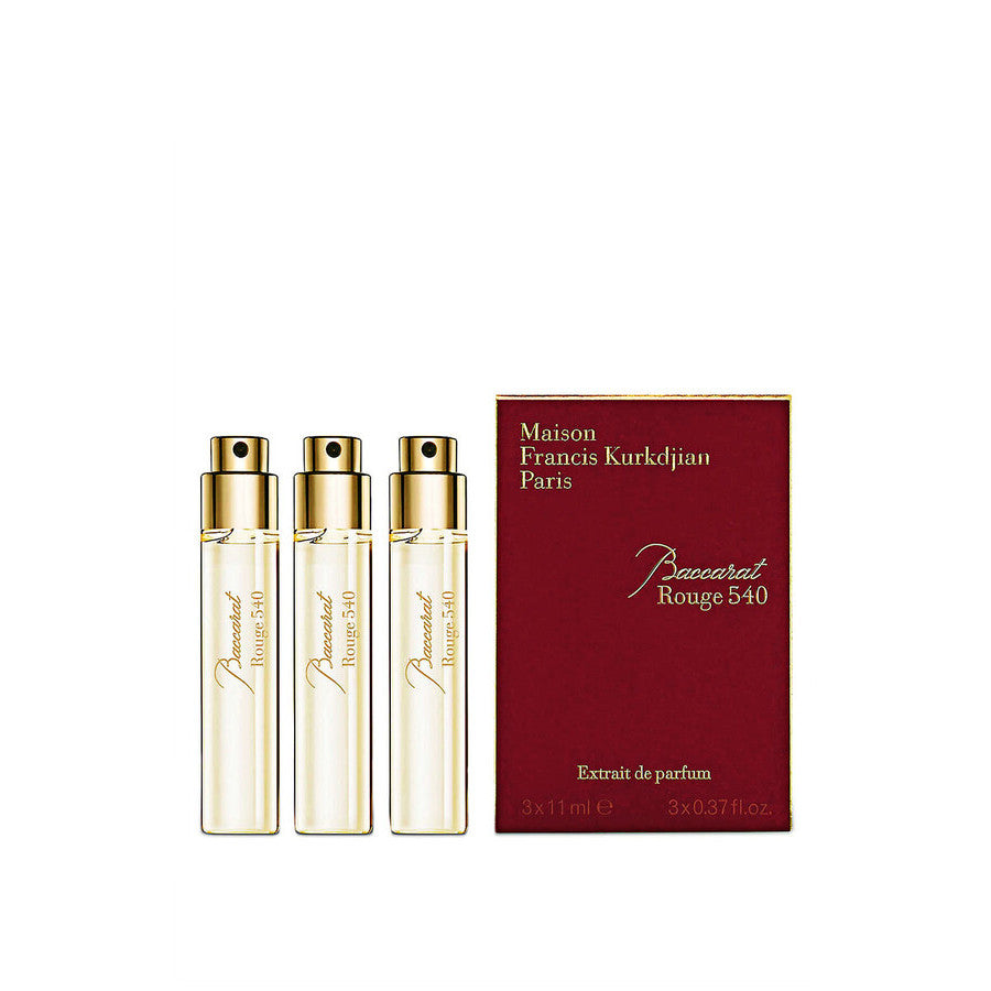 Three perfume bottles and their packaging on a white background