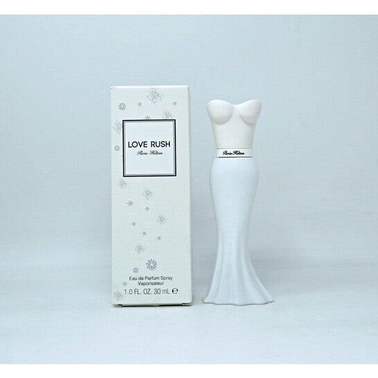 image showing the bottle and packaging for Paris Hilton Love Rush Perfume By Paris Hilton Eau De Parfum Spray 30ml