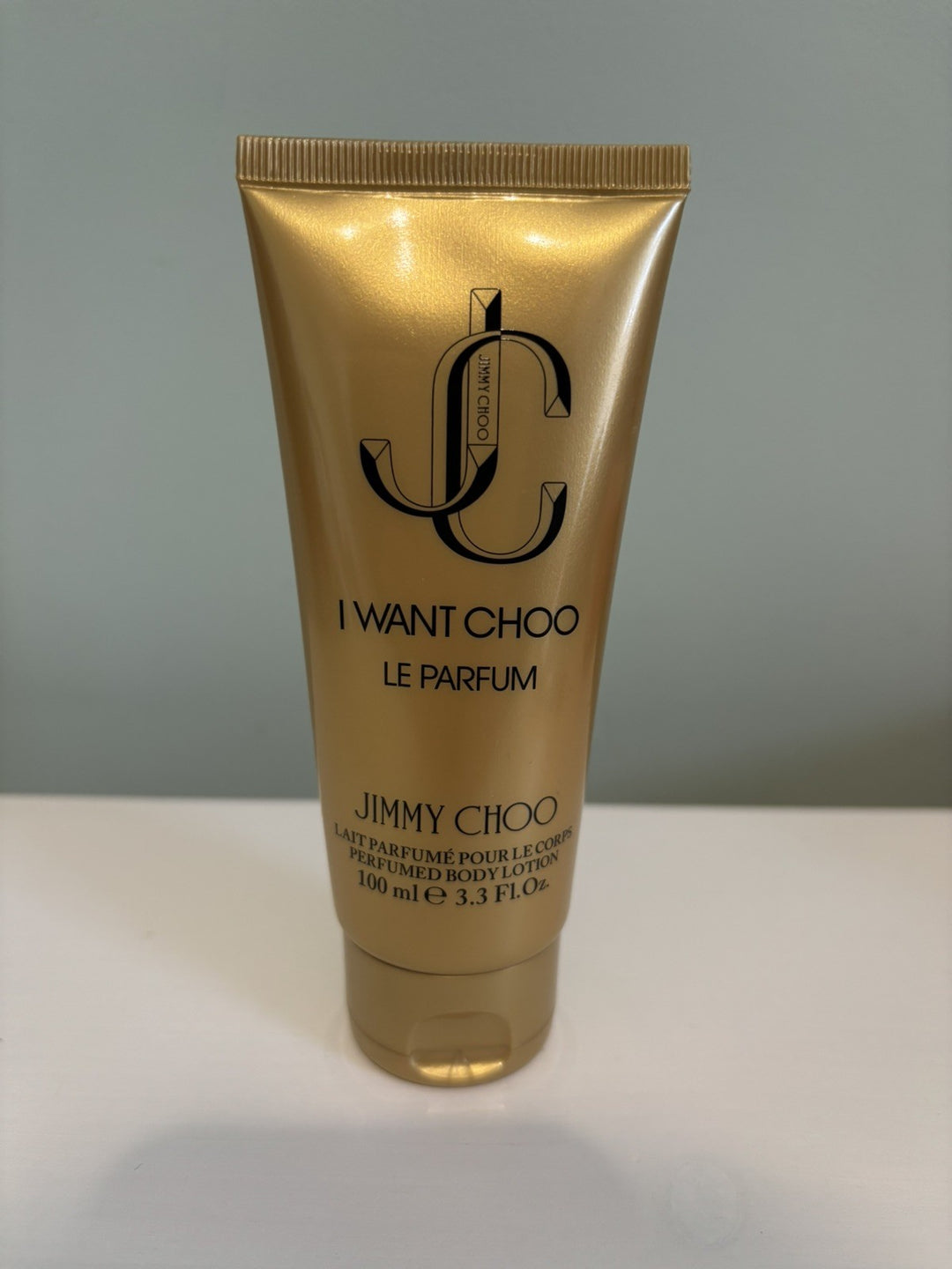 image showing the bottle and packaging for Jimmy Choo I Want Choo Le Parfum Perfume By Jimmy Choo Body Lotion 100ml